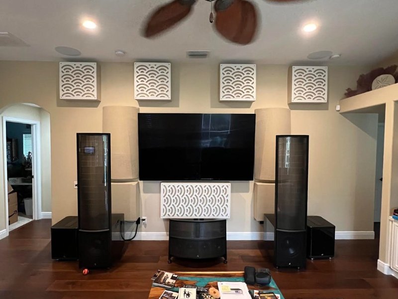 MartinLogan electrostatic tower speakers with acoustic treatments in a home theater