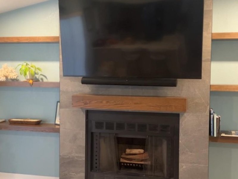 TV and Soundbar on Grey Stone Fireplace