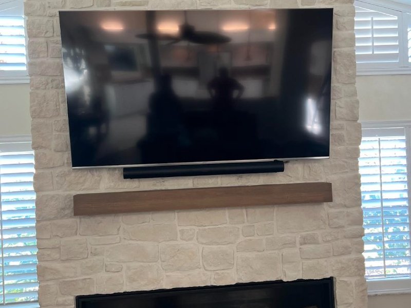 TV Mount on Vaulted Stone Fireplace